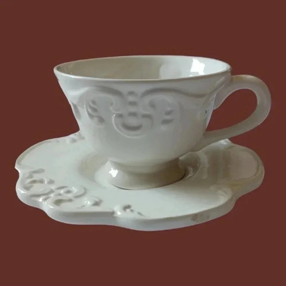 Shabby chic porcelain teacup and saucer